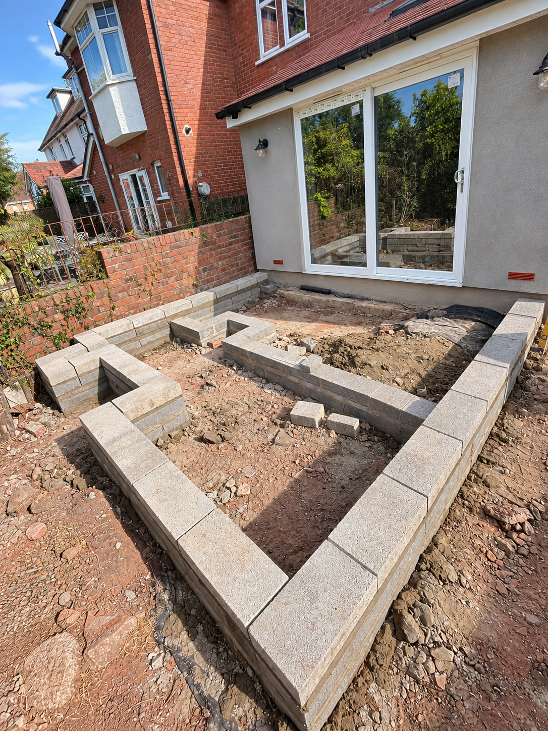 Concrete blockwork for a raised patio during construction