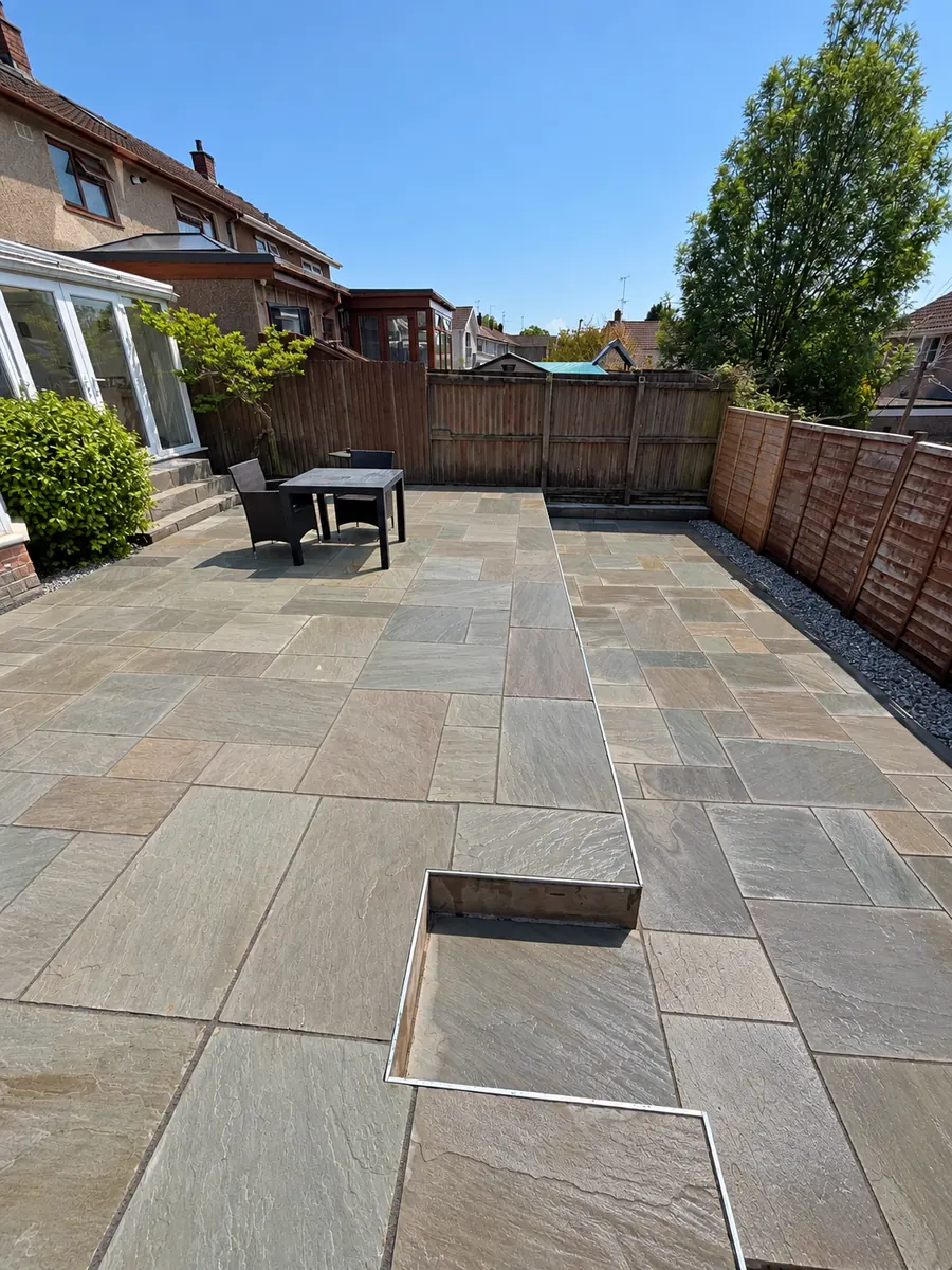 Finished sandstone patio outside conservatory
