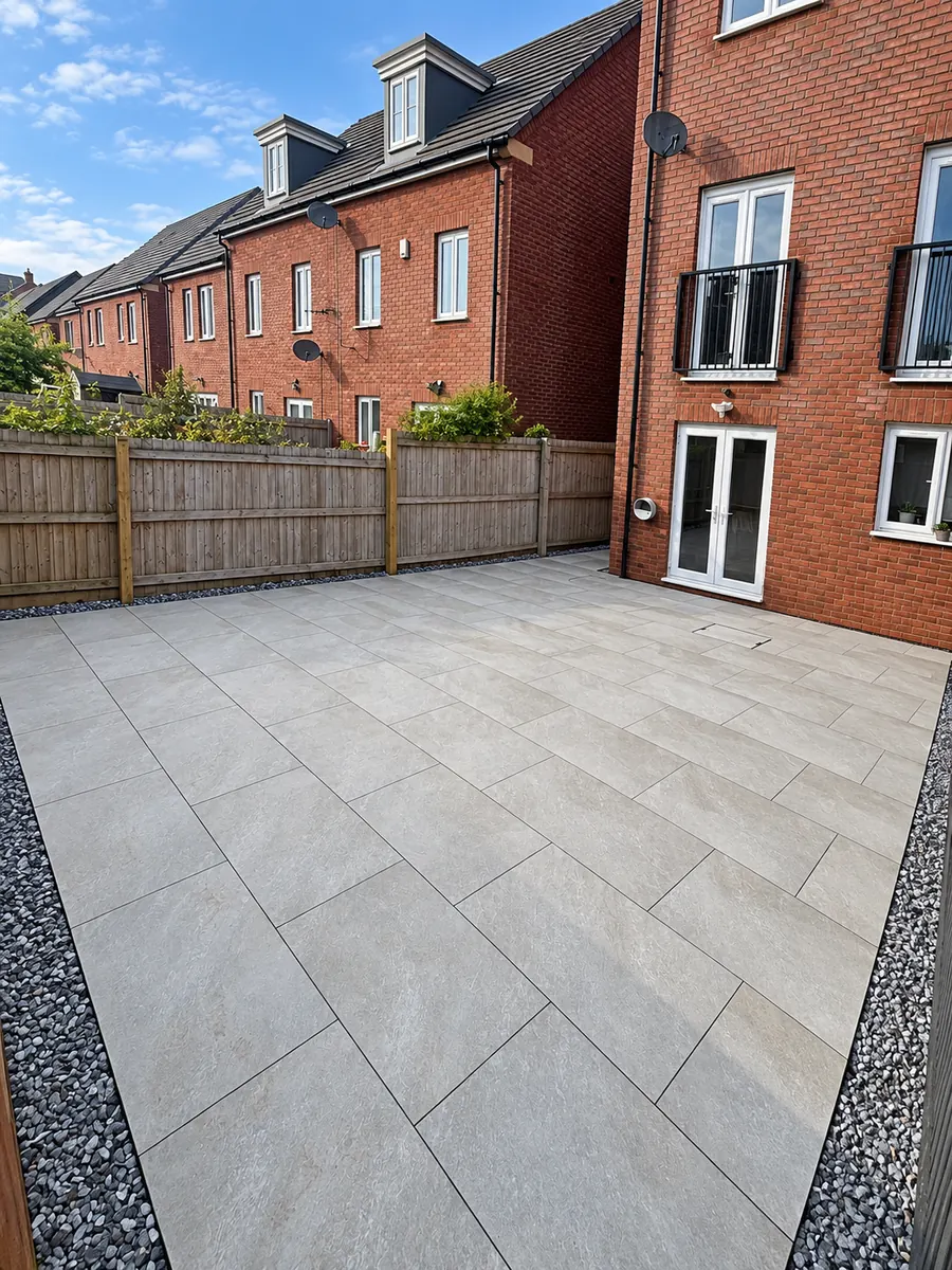 Finished grey slab patio outside townhouse