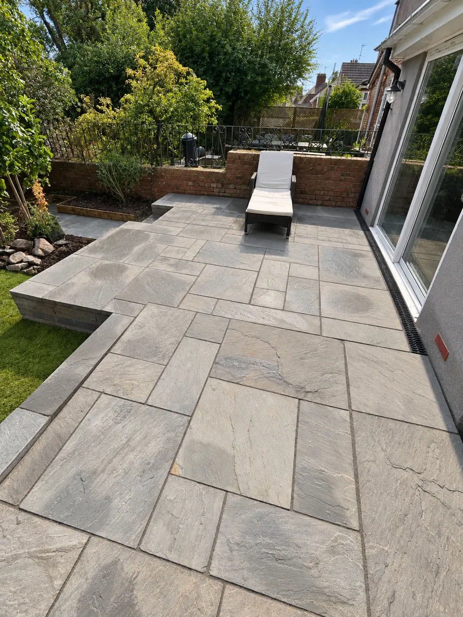 Raised stone slab patio, steps and garden path