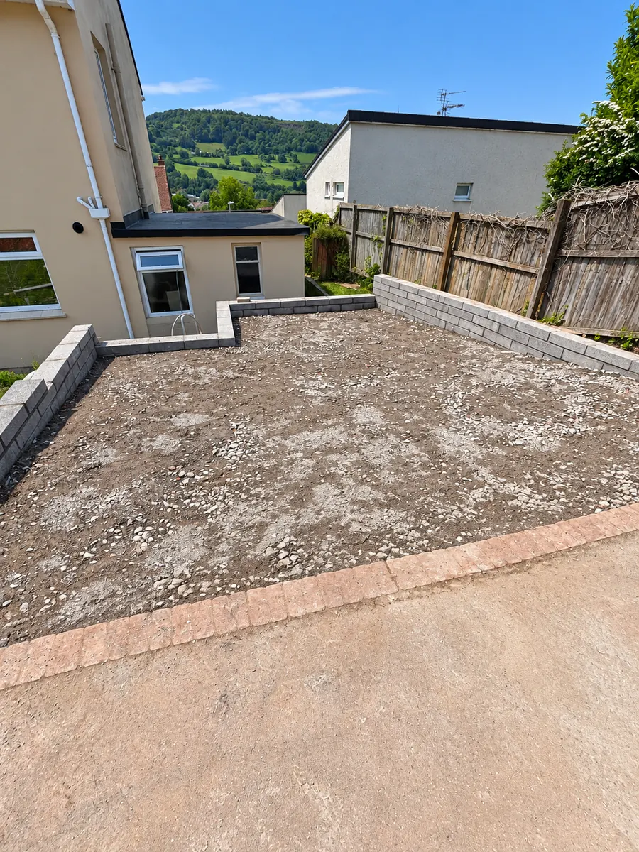 Compacted driveway base; no finished tarmac yet