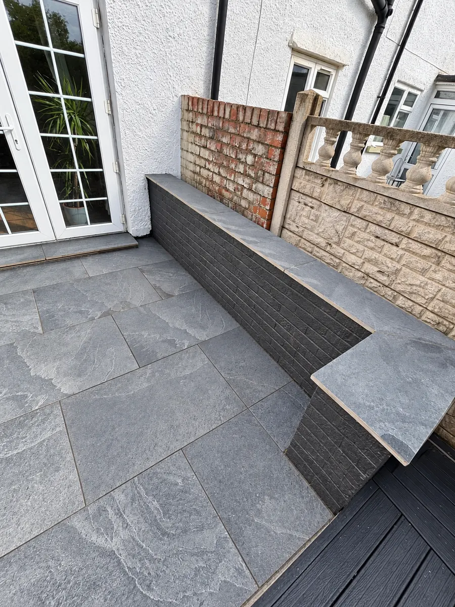 Grey slab courtyard with built-in bench